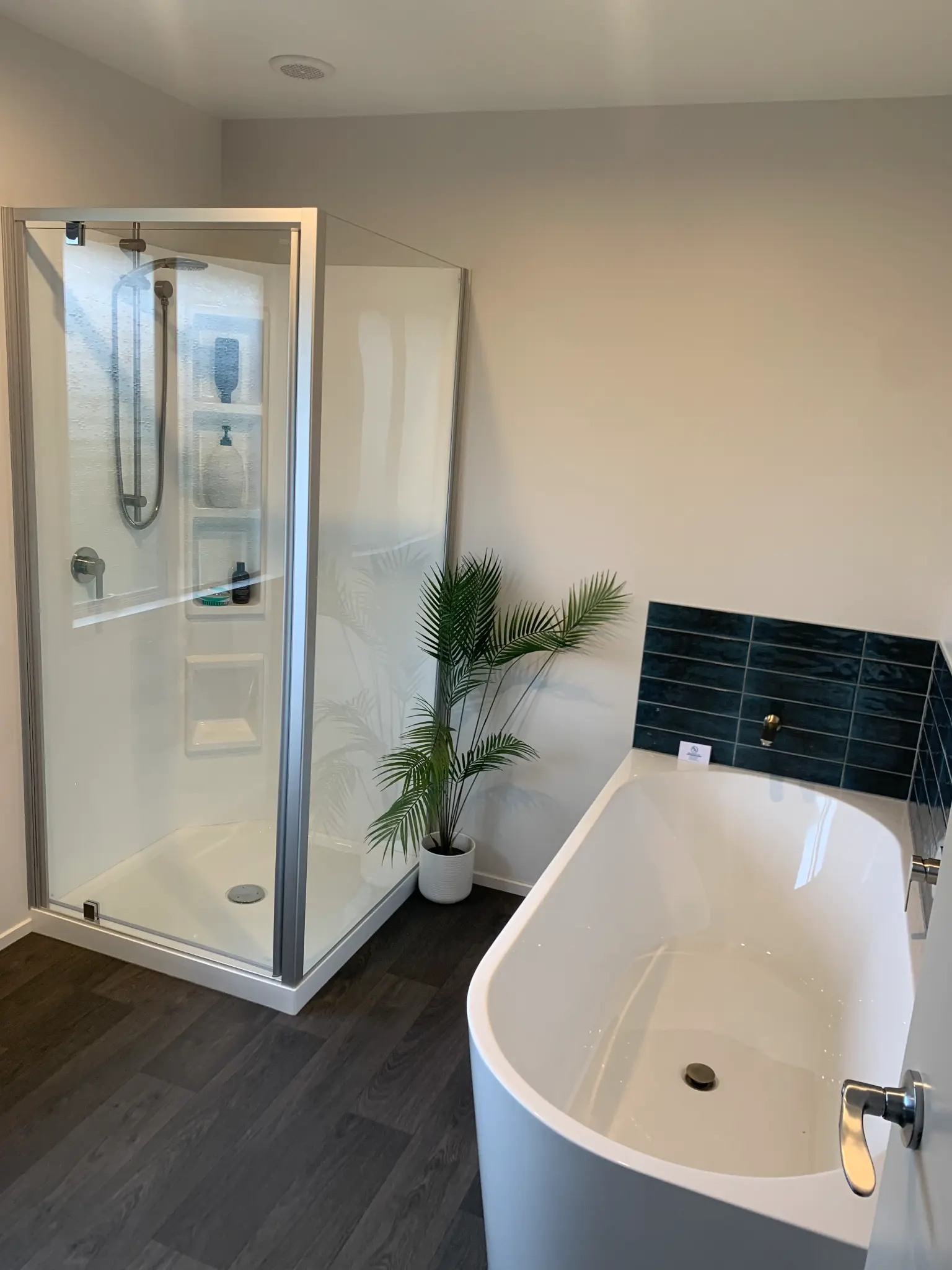 Completed bathroom with bath and shower from an AA Bathrooms project